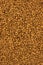 Background of freeze-dried granulated instant coffee macro close-up.
