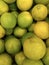 Background of fresh green limes closeup, fruits on sale, mobile photo