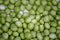 Background with fresh organic green peas. Close-up view from above