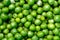Background of fresh, young, peeled green peas