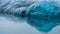 Background of glacier edge over the lake and water line