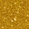 Background with gold glitter. Bright sparkling texture. Pattern with shining fine gold sequins. Festive luxury golden background