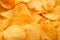 Background of golden wavy corrugated chips large slices with sea