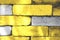 Background of gray-yellow brick wall