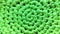 Background from green fabric woven in circles close-knit weaving fabric