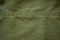 Background of green grunge military fabric, cloth with textures