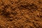 Background of ground cocoa powder from above