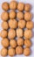 Background with Group of Whole Walnuts Blue Background Top View Vertical Tasty Nuts Pattern