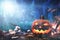 Background halloween pumpkin with spiders at night in forest blue