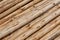 Background of hand peeled pine tree diagonal logs