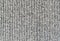 Background of Handmade Knitted fabric of wool Gray color, cloth knitted texture