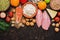 Background with healthy food. Red fish, chicken fillet, vegetables, fruits, cereals, dairy products, quail eggs. Top view, copy sp