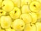 Background of heap fresh yellow apple