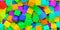 Background from heap of rainbow or spectrum colored cubes, creativity or toy concept, flat lay top view from above