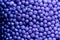 Background heap of violet small balls for bath