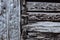 Background of heavily weathered hand chiseled beams and notched