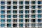 Background with hotel windows with chairs on the balconies