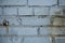 Background image of an abandoned brick wall with painted over paint