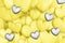 Background image made of yellow and gray volumetric hearts. Trendy colors of Year 2021. 3d rendered illustration