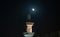 Background image of mosque minaret during full moon night