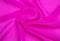 Background image of a pink light fabric folded