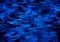 Background of intersecting satin blue wavy stripes and lines