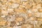 Background of irregular cobblestones light beige color. Design backgrounds texture