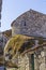 Background landscape with an unusual stone house from a huge boulder wall in the village of Monsanto