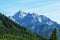 Background landscape view of the snowy peaks of the Alps and the forest In the Tyrol