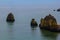 background landscape view of unusual rocks in a bay off the coast of one of the beaches of Lagos