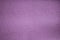 Background of light violet suede fabric closeup. Velvet matt texture of lilac nubuck textile