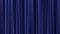 Background lighting effect of a light shining on a closed velvet curtain such as used in a cinema