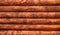 Background. A log wall of wooden house