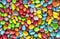 Background made of colorful candy dragee, multi-colored glazed raisins