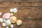 Background made of a group of clam shells of different sizes and shades on an aged wooden board
