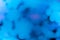 Background made of light blue blurred sparkles