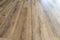 Background made of modern vinyl panels imitating wood in a living room with selective focus.