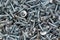 Background of many drywall screws close up