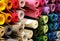 background of many rolls of colored felt