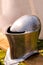 Background medieval army metal helmet defense knight forged armor close-up shiny design base