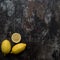 Background for the menu. Brown shabby background with lemon. Copy space