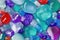 Background of multi-colored, colorfull, shiny, glass, precious or semi-precious stones.