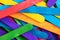 Background from multicolored boards in colors of rainbow. Piles of colorful wooden planks