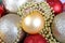 Background from multicoloured christmas balls, close-up gold ball
