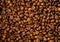 Background of natural coffee beans, clean food choice, close-up, copy space