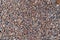 Background of natural grey granite crushed stone, macadam. Macro photo of texture of broken stone or rubble with place