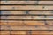 Background of natural knotted wood fence.