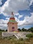 On the background of nice clouds, photo of Colorful isolated image of a temple in the outskirts of village