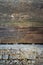 Background of old peeled cracked wood, stacked old boards