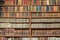 Background of old vintage books on wood bookshelf in a library